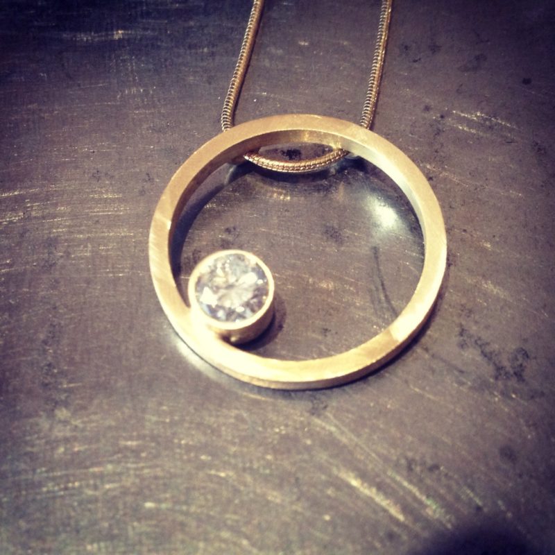 Gold circle necklace with diamond